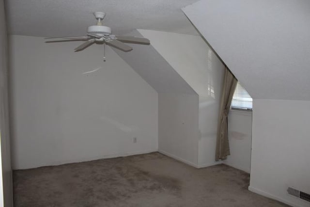 bonus room with carpet, ceiling fan, and vaulted ceiling