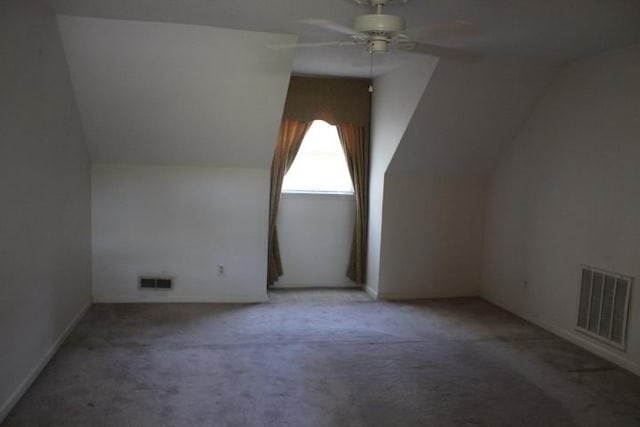 additional living space with carpet, ceiling fan, and vaulted ceiling