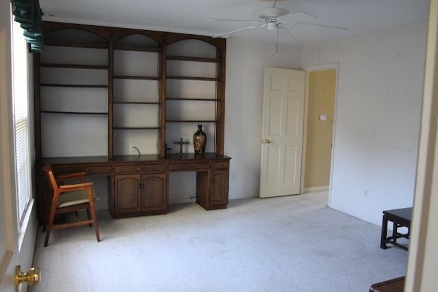 carpeted office with ceiling fan