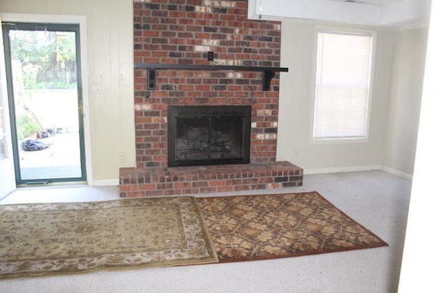 carpeted living room featuring a fireplace