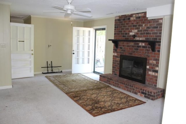 carpeted living room with a brick fireplace and ceiling fan