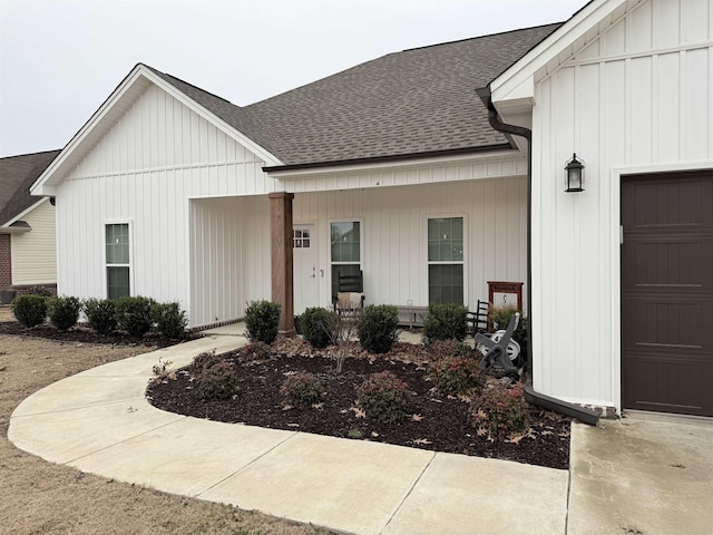 view of front of property with a garage and a porch