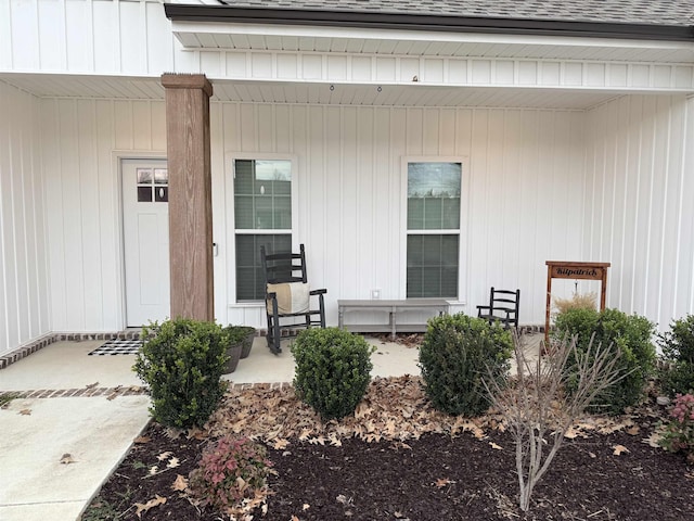 view of exterior entry with a porch