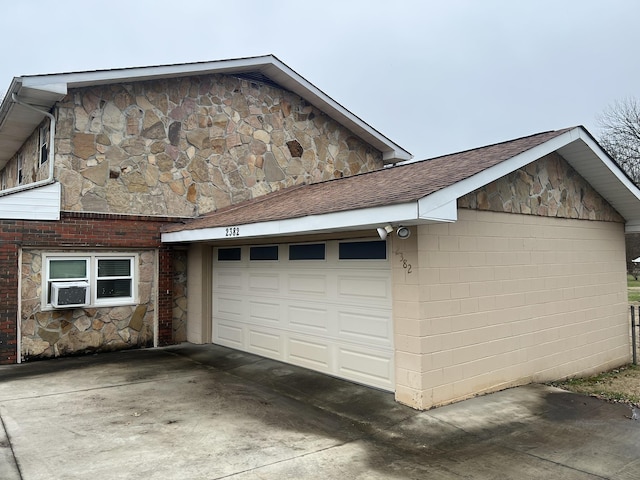  - garage with concrete driveway