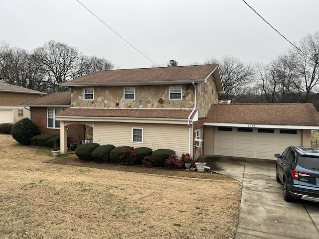  - view of front of home with driveway, an attached garage, a front yard, a shingled roof, and cooling unit