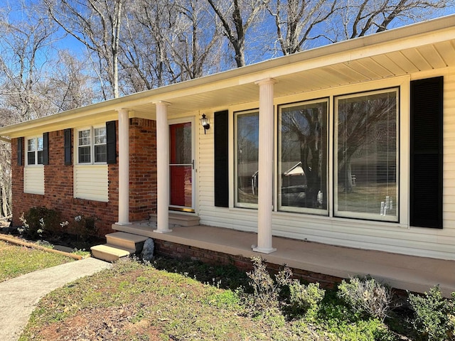 exterior space with brick siding