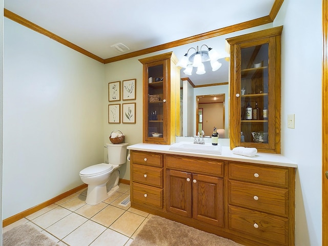 bathroom featuring tile patterned flooring, vanity, toilet, and ornamental molding