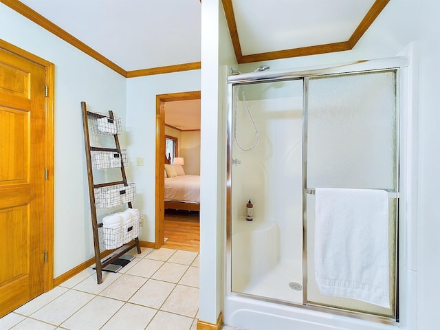 bathroom featuring walk in shower, tile patterned flooring, and ornamental molding