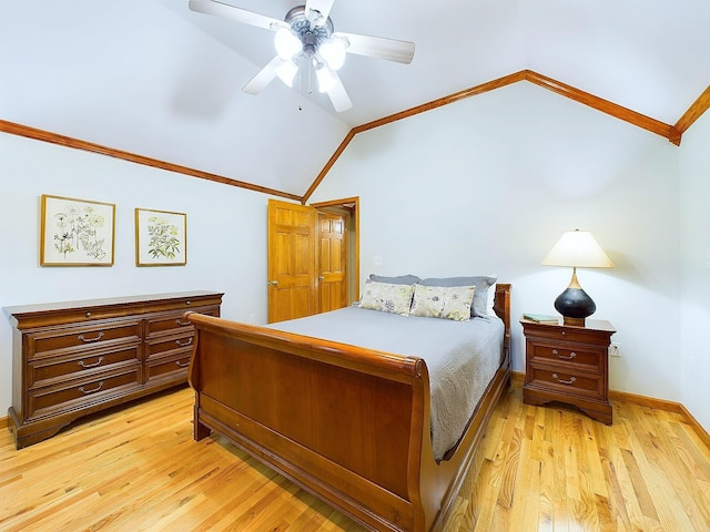 bedroom featuring ceiling fan, ornamental molding, lofted ceiling, and light wood-type flooring