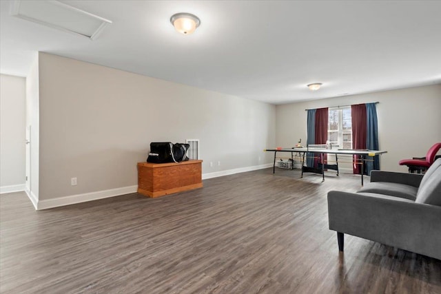 sitting room with dark hardwood / wood-style flooring