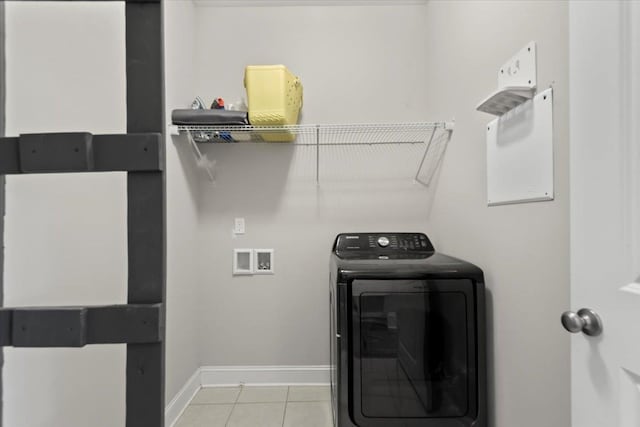 laundry room featuring light tile patterned floors and washer / clothes dryer