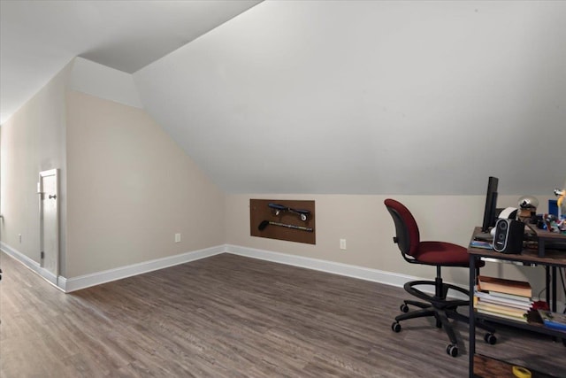 office area with dark hardwood / wood-style floors and lofted ceiling