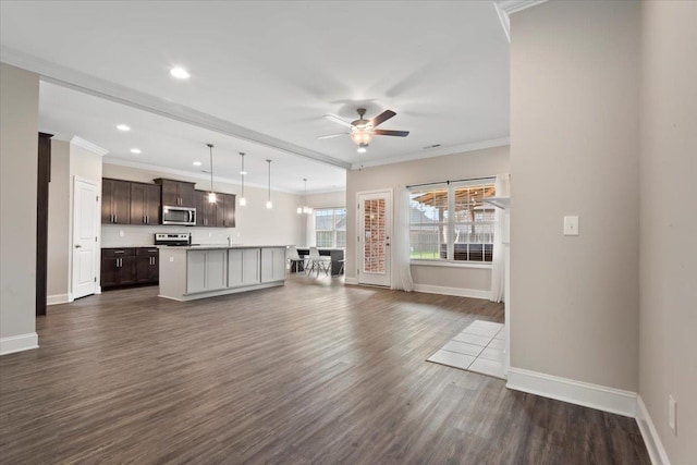 unfurnished living room featuring ceiling fan, dark hardwood / wood-style flooring, and ornamental molding