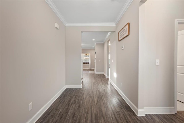 corridor featuring ornamental molding and dark wood-type flooring