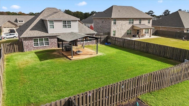 rear view of house with a patio and a lawn