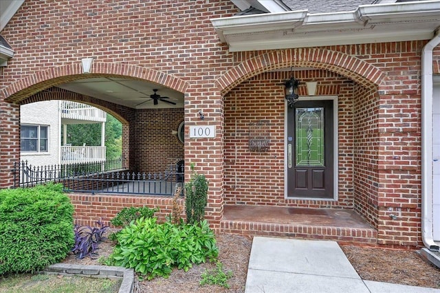 property entrance with ceiling fan