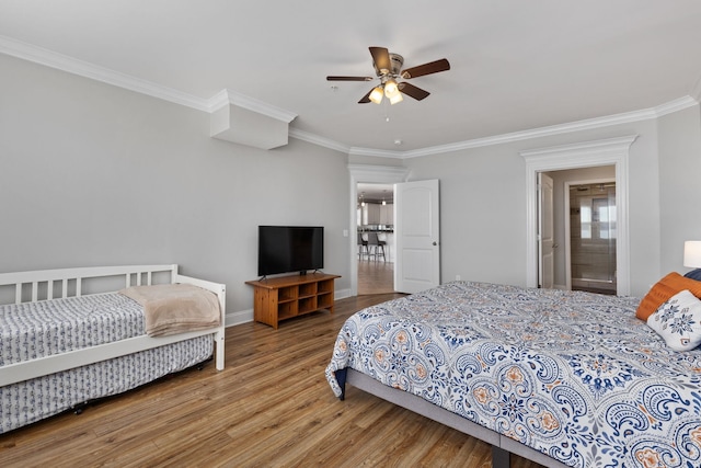 bedroom with ceiling fan, hardwood / wood-style floors, and crown molding