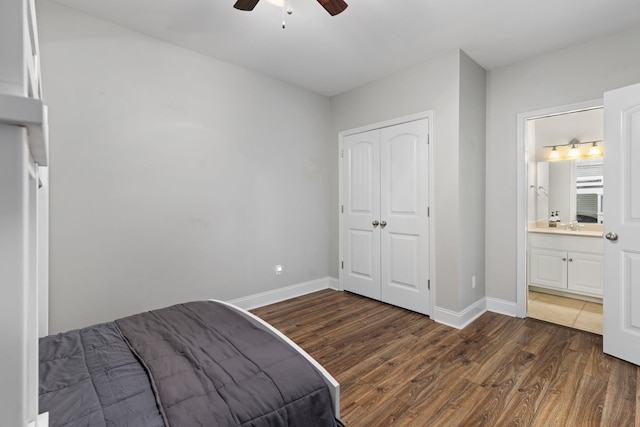 bedroom with dark hardwood / wood-style flooring, a closet, ceiling fan, and ensuite bathroom