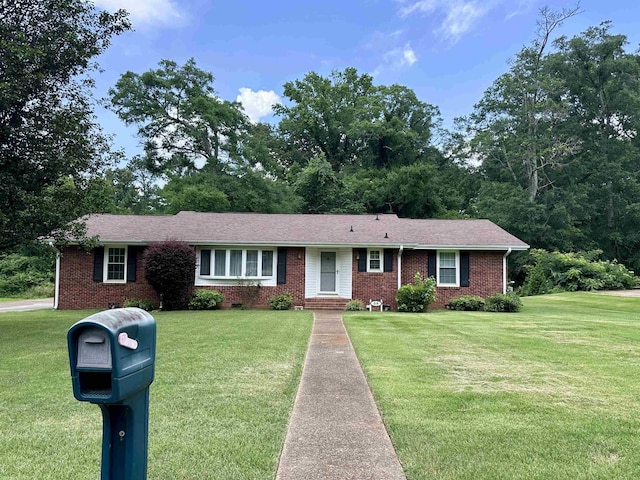  - single story home featuring brick siding and a front lawn