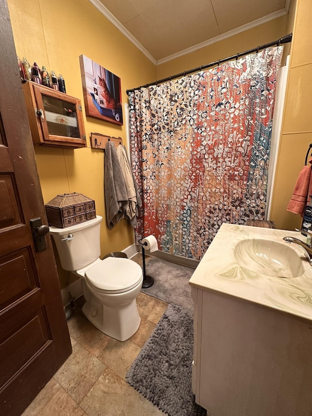 full bath featuring ornamental molding, vanity, and toilet