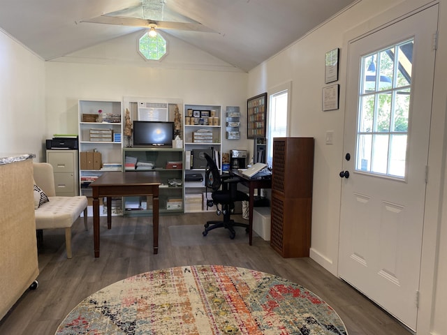 home office featuring vaulted ceiling, ornamental molding, wood finished floors, and a ceiling fan