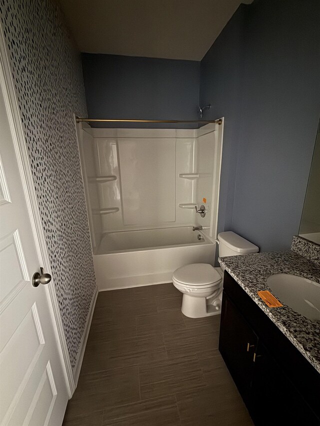  - full bathroom with toilet,  shower combination, and vanity