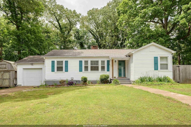  - single story home with a garage, a chimney, a shingled roof, driveway, and view of wooded area
