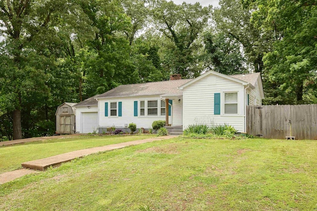  - single story home featuring a shed, roof with shingles, an attached garage, and a chimney
