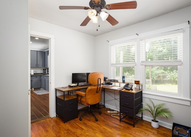  - office with wood finished floors and ceiling fan