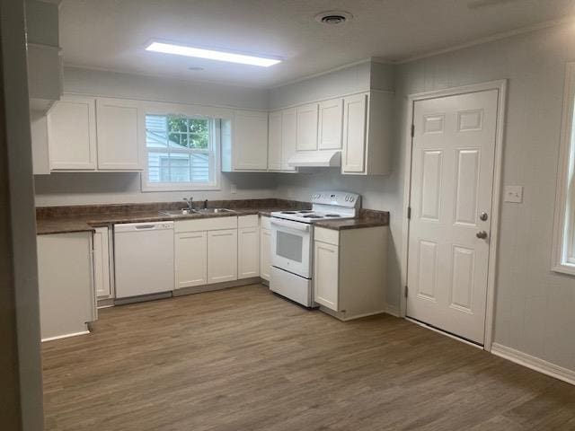 kitchen featuring white cabinetry, sink, dark wood-type flooring, and white appliances