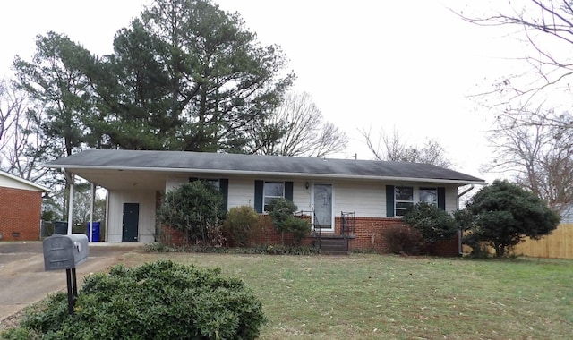 ranch-style home with a front yard and a carport