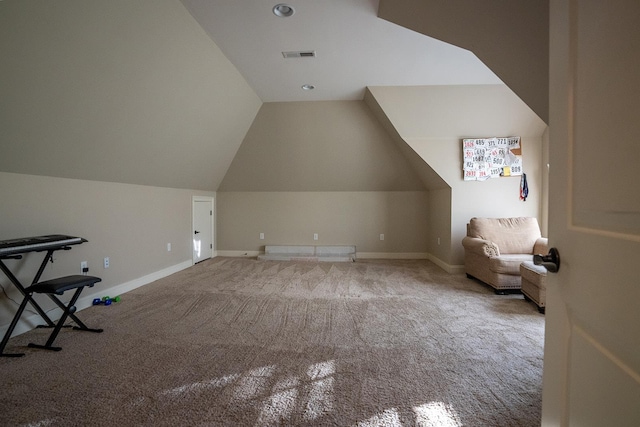 bonus room featuring vaulted ceiling and carpet flooring