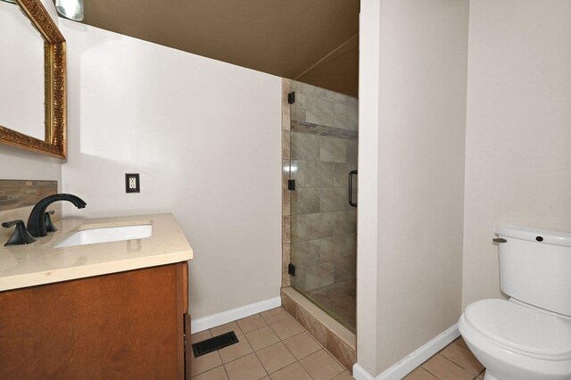  - full bathroom with vanity, a stall shower, and tile patterned flooring