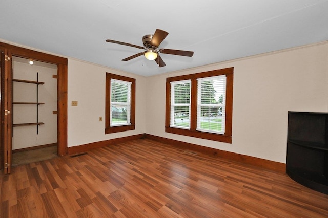  - unfurnished living room featuring wood finished floors and a ceiling fan