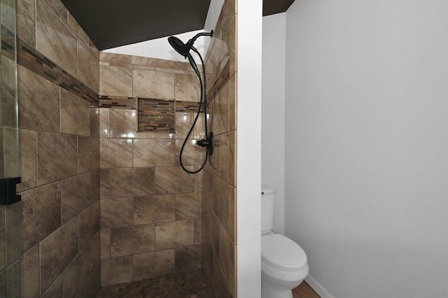  - bathroom featuring a tile shower