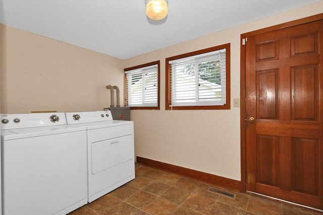  - washroom with washer and dryer and baseboards