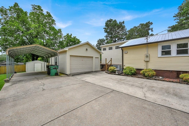  - detached garage with a storage unit and a detached carport