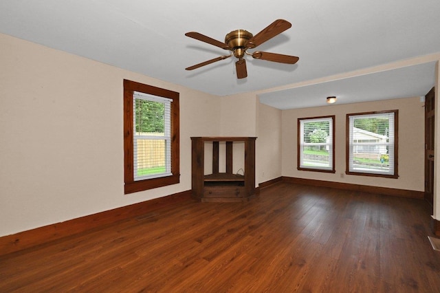  - unfurnished living room with plenty of natural light, dark wood-style floors, and a ceiling fan