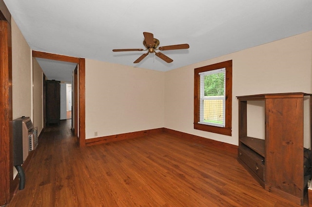  - unfurnished living room featuring wood finished floors and ceiling fan