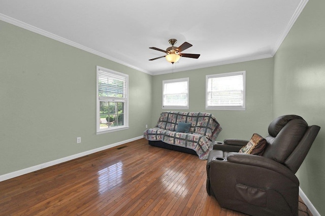 - living area with ornamental molding, wood-type flooring, and ceiling fan