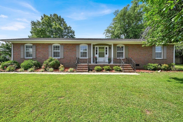 - ranch-style home with brick siding, a porch, and a front lawn