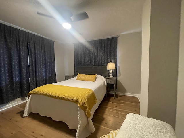 bedroom featuring hardwood / wood-style flooring and ceiling fan