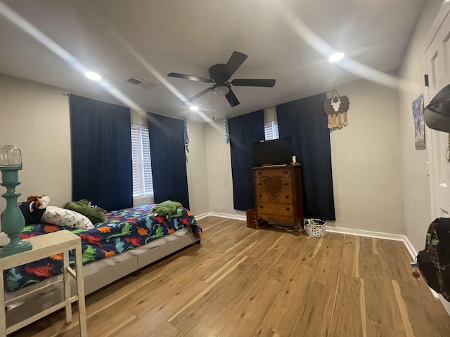 bedroom featuring hardwood / wood-style flooring and ceiling fan