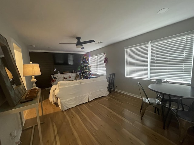 bedroom featuring ceiling fan and hardwood / wood-style flooring