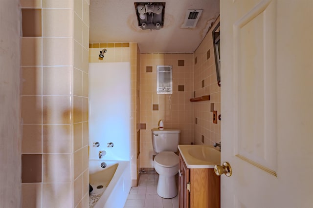 full bath featuring vanity, tile walls, toilet, tile patterned flooring, and visible vents