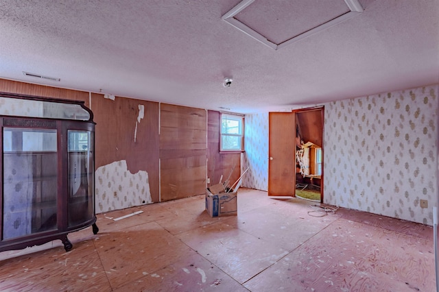 interior space featuring visible vents and a textured ceiling