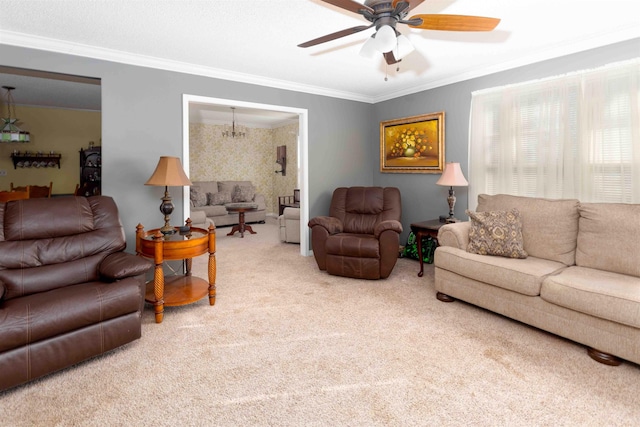 carpeted living room featuring crown molding and ceiling fan with notable chandelier