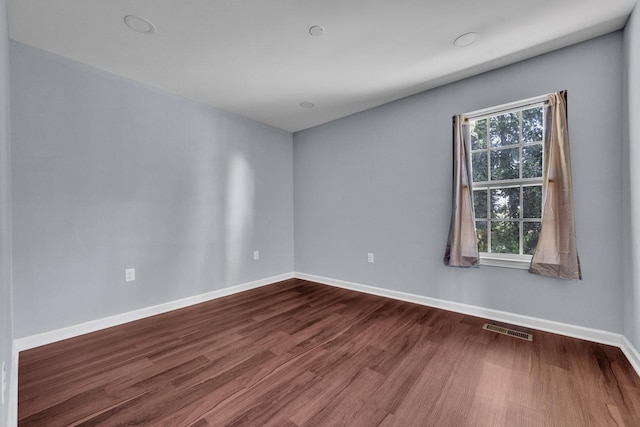 unfurnished room featuring hardwood / wood-style floors