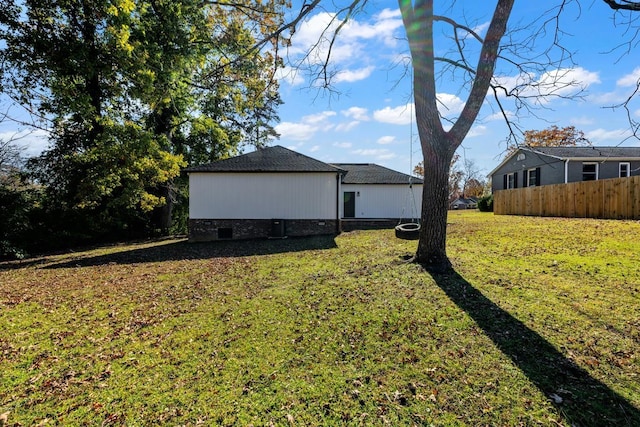 view of side of home featuring a yard