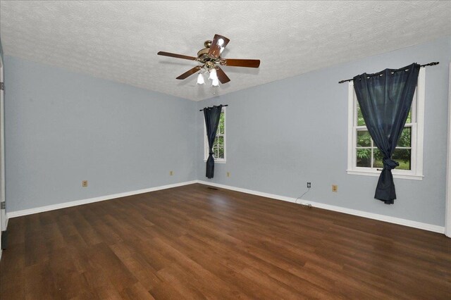  - spare room featuring wood finished floors, a ceiling fan, a textured ceiling, and baseboards